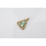 A certificated 9ct gold fluorite and white topaz pendant, the central blue oval mixed cut surrounded