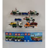 A collection of unboxed and unchecked Lego City, including two Pickup Tow Truck 60081 with manuals