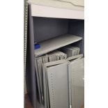 A quantity of grey metal storage shelves, and uprights