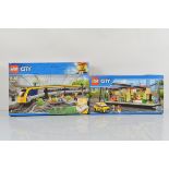 Two boxed Lego City models, including Train Station 60050 opened with manual, unchecked and