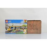 A boxed Lego City Passenger Train, 60197, unopened together with a quantity of 9 Volt track (2)