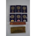 A commemorative certificated gold bank note, $100 US in plastic sleeve, together with six
