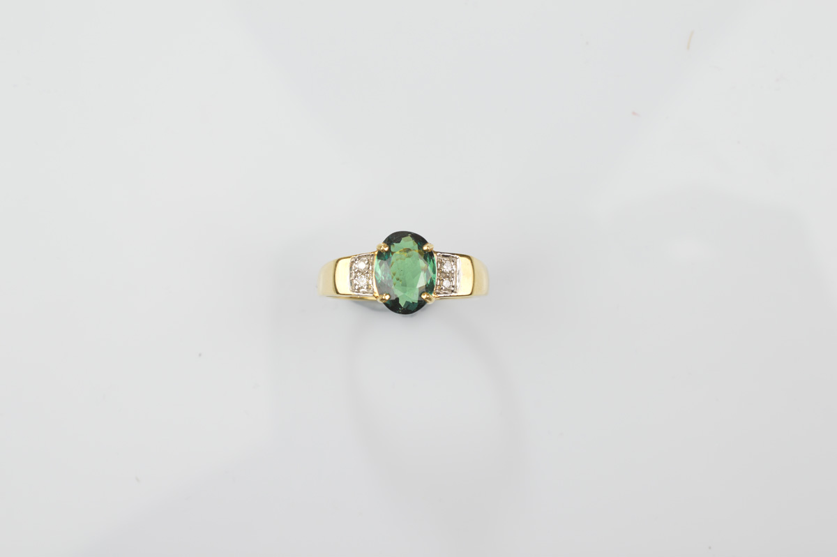 A certificated 18ct gold Russian alexandrite and diamond dress ring, the oval central mixed cut