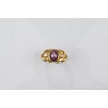 A certificated 9ct gold star ruby and white sapphire gentleman's dress ring, the central cabochon