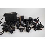 A collection of assorted cameras, lenses and accessories including, Pentax, Minolta Sony examples.