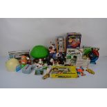 A collection of 1980s and 1990s children's toys, including a Fisher Price Tree House, a Grandstand