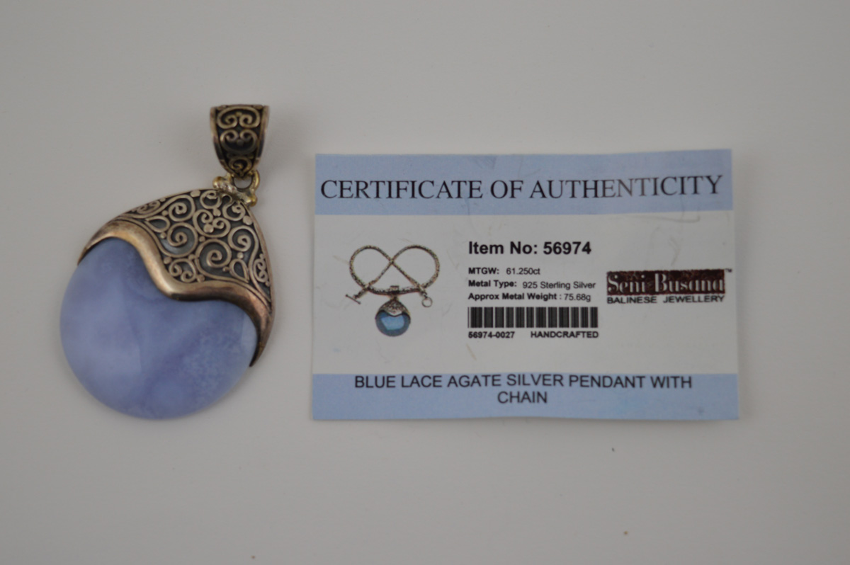 A certificated blue lace agate and silver pendant, the polished disc encased in filigree mount - Image 2 of 2
