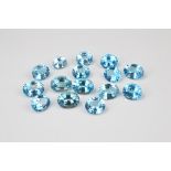 A collection of fifteen oval mixed cut loose topaz, blue in colour, 146ct (15)