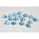 A collection of sixteen oval mixed cut loose topaz, blue in colour, 175ct (16)