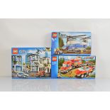 Three boxed Lego City models, including Police Station 60141 unopened, Fire Transporter 4430