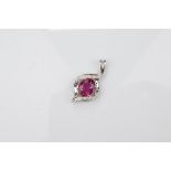 An 18ct gold certificated rubellite and diamond pendant, the oval dusty pink tourmaline in four claw