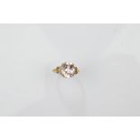 A certificated 9ct gold medina morganite and diamond dress ring, oval mixed cut in claw setting with