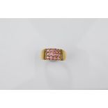 A certificated 9ct gold garnet gentleman's tablet ring, the rhodolite pink round cut stones in