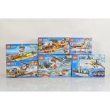 Six boxed Lego City models, including Heavy Cargo Transport 60183 opened with manual, unchecked,