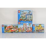 Four boxed Lego City models, including Fire Station 60110 unopened, Train Station 7997 opened with