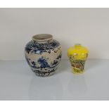 Two Chinese porcelain vases, one in the provincial manner with a depiction of figures in a garden in