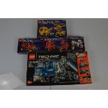 A collection of five boxed Lego Technic vehicles, including 8034 with manual , 8810 with manual ,