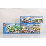 Four boxed Lego City models, including Service Station 60132 unopened, Classic Truck 7998 opened