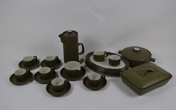 A Denby stoneware dinner set with dark green ground and chevrons, including a coffee pot, plates,