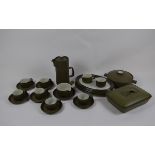 A Denby stoneware dinner set with dark green ground and chevrons, including a coffee pot, plates,