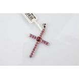 A 9ct gold rhodolite garnet cross pendant, with central claw set square cut garnet surrounded by