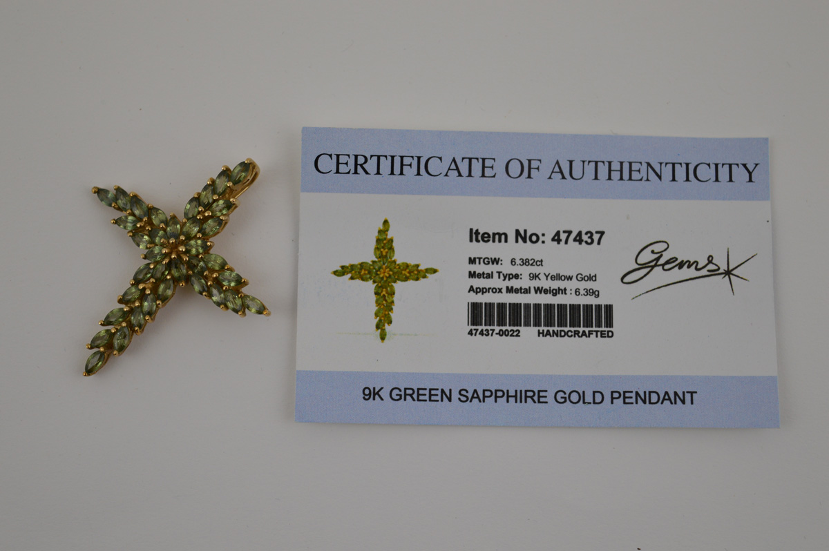 A certificated 9ct gold green sapphire cross pendant, the oval mixed cut claw set sapphires all in - Image 2 of 2