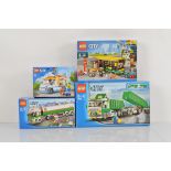 Four boxed Lego City models, including Classic Truck 7998 opened with manual and unchecked, Bus