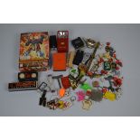 A collection of miscellaneous toys, keyrings, toy keys, etc including a boxed Bandai Action Figure