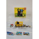 A collection of loose and empty boxes of Lego, including manual manuals, 6054 box Robin Hood, a