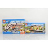 Two boxed Lego City models, including High Speed Passenger Train 60051 unopened and Train Station