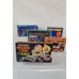 A collection of 1970s and 1980s video game consoles, including Interstate, Prinztronic Micro Ten,