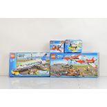 Four boxed Lego City models, including Airport Air Show 60103 opened with manual, unchecked,