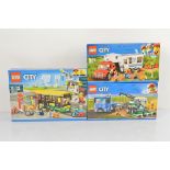 Three boxed Lego City models, Bus Station 60154, Harvester Transport 60223 and Pickup and Caravan