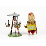 A Wilhelm Krauss Tinplate Fun Fair Boat Carousel Toy, with push down spiral mechanism, three