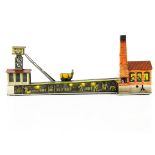 Early Arnold Tinplate Clockwork Coal Mine Toy, detailed tinprinted toy with Coal Wagon moving