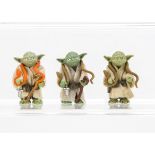Vintage Star Wars Yoda Action Figures, three examples, two with brown eyes, one with black eyes, F-