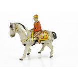 A Pre-War Keim & Co Tinplate Clockwork Horse & Jockey, detailed tinprinted horse in white with