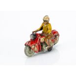 A Schuco 1005 Tinplate Clockwork Charly Motorcycle, detailed tinprinted motorcycle in red with black