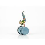 An Erco (Leonhard Erdel) Tinplate Clockwork Clown On Barrel, 1950s tin toy, light blue barrel with