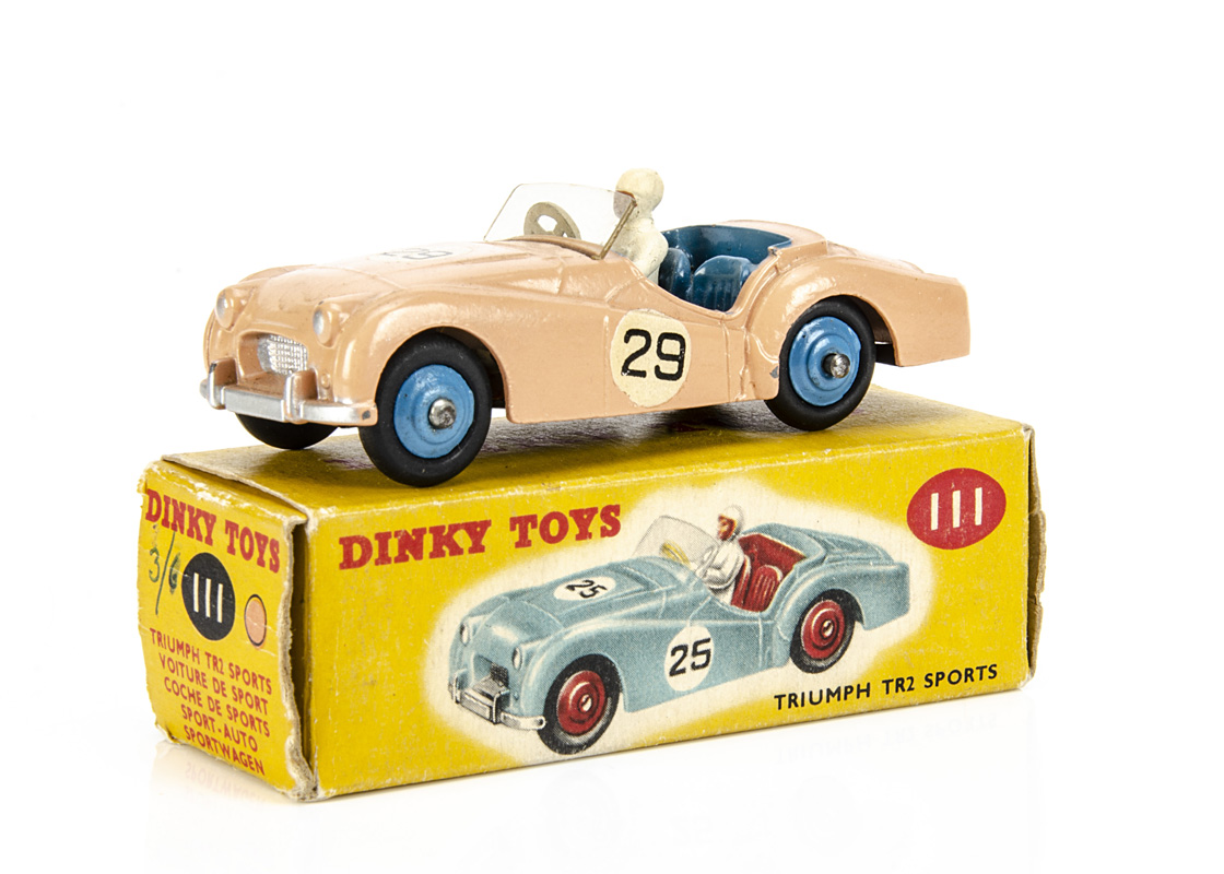 A Dinky Toys 111 Triumph TR2 Sports, competition finish, salmon pink body, blue interior and hubs,