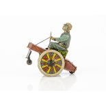 A CKO Kellerman Tinplate Clockwork Stubborn Tricycle Nr.225, detailed tinprinted toy, red body