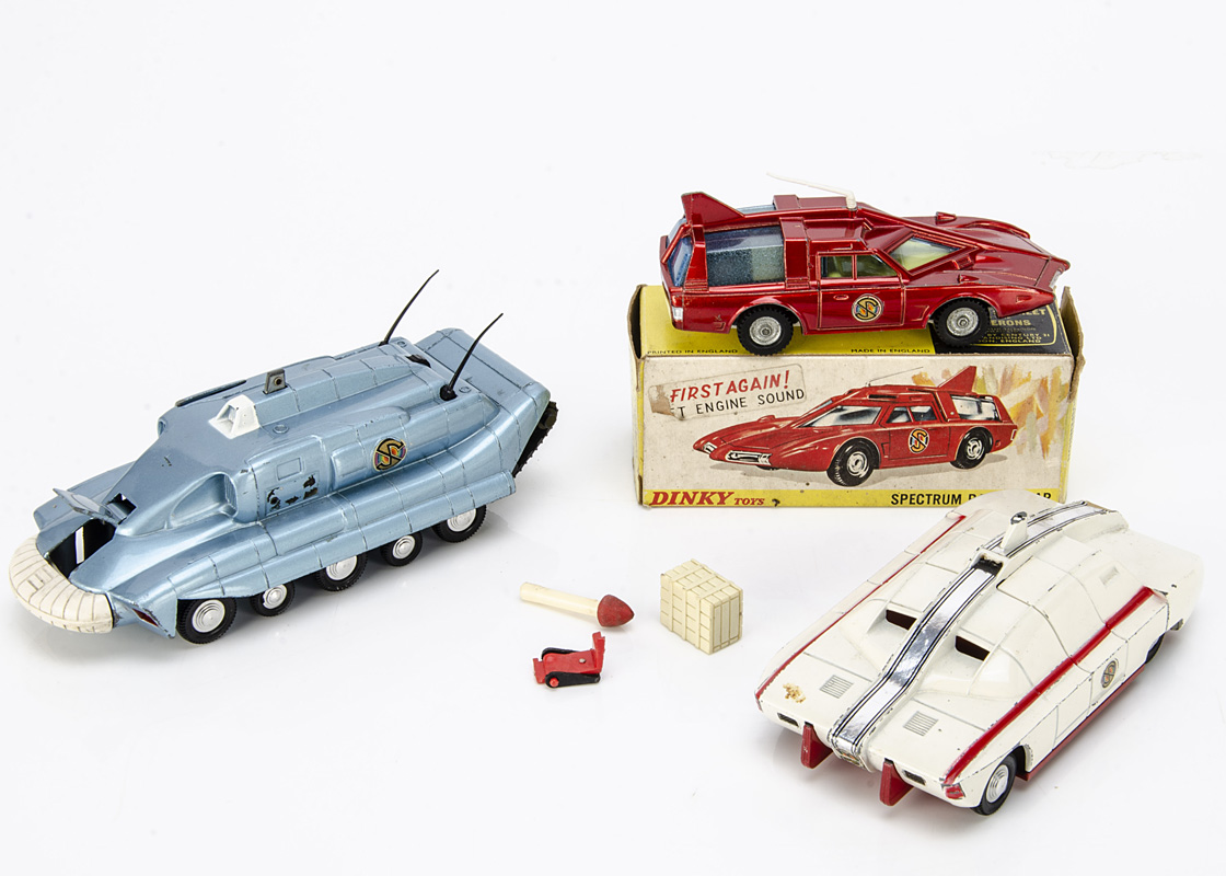 A Dinky Toys 103 Spectrum Patrol Car From Captain Scarlet, metallic red body, white base, blue