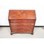 Georgian bureau, with fitted interior, drop front over four graduated drawers having brass Swan neck