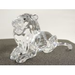 A Swarovski crystal figure of a male lion, from the Swarovski Crystal Society the 'Annual Edition