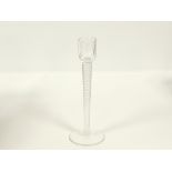 A St Louis glass candlestick with twisted stem, the base with printed St Louis France back stamp,
