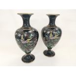 A pair of Victorian Shropshire Jackfield black pottery vases, with polychrome enamel decoration of