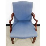 A contemporary Georgian style arm chair, upholstered in a blue fabric, raised on square reeded front