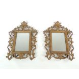 A pair of 20th Century freestanding cast metal gilt frames containing mirrors, 30cm x 20cm (2)