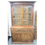 A 19th century figured mahogany secretary bookcase, the top section having a moulded cornice above a