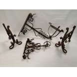 A group of nine early 20th Century cast iron metal wall fixtures, the largest with decorative pocket